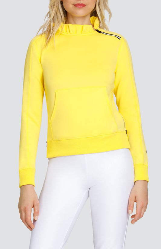 Model is wearing bright Yellow pullover with side zipper at the collar and kangaroo pocket. Paired with Chalk Mulligan Capris.