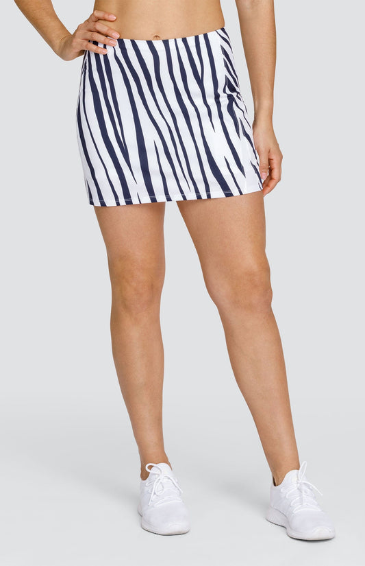 Model is wearing a Navy Blue and Chalk Tiger striped skort with built-in shorts.