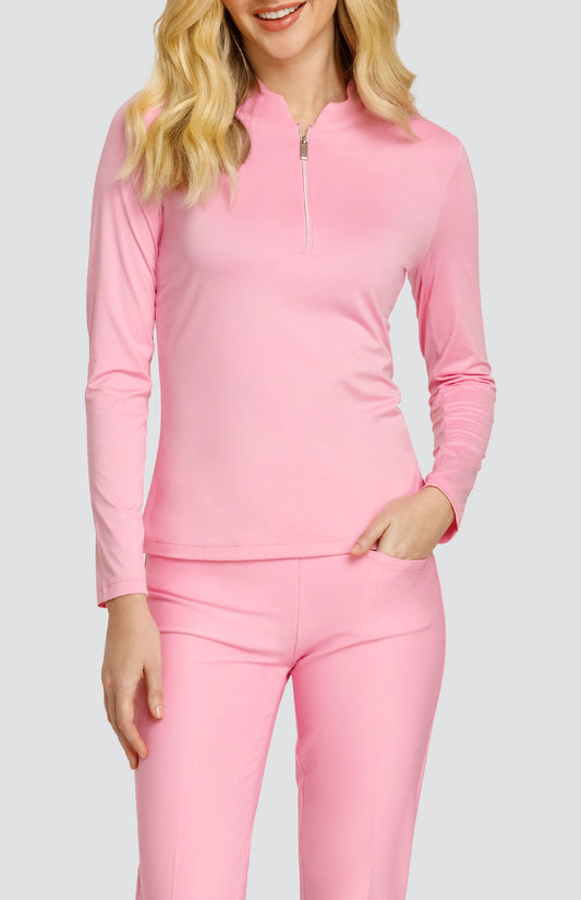 Model wearing a solid pink long sleeve top and solid pink pants.